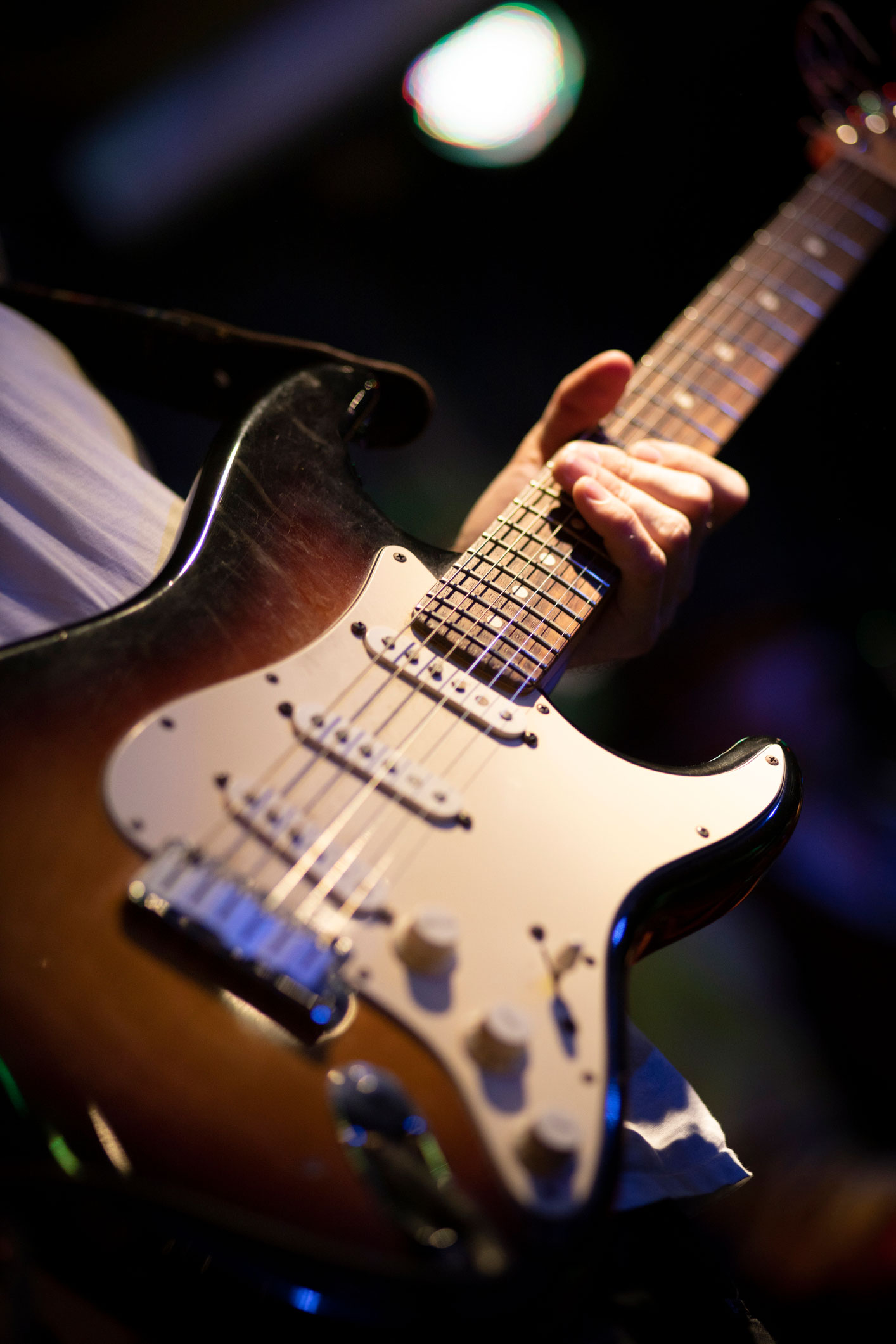 Close up of an electric guitar being played