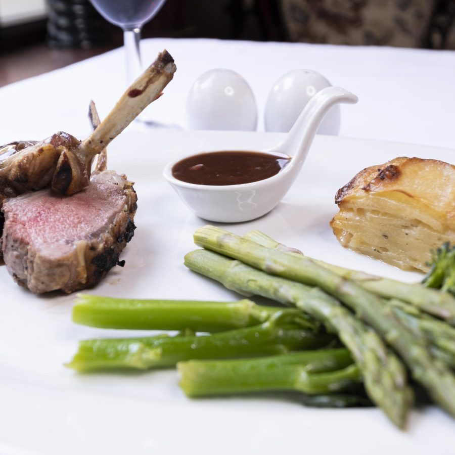 Rack of Lamb with Dauphinoise Potato Asparagus and a Redcurrant Port Sauce in the Olive Tree Restaurant