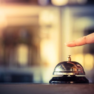 Hotel service bell being rung by guest